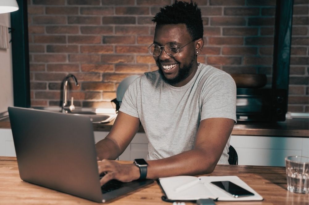 man with glasses and a laptop