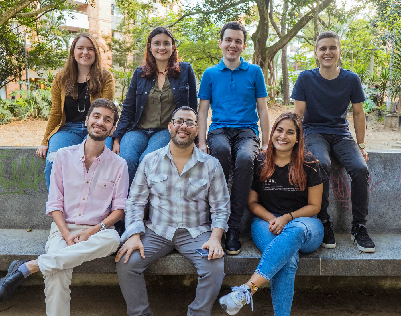 Support team group photo on a bench